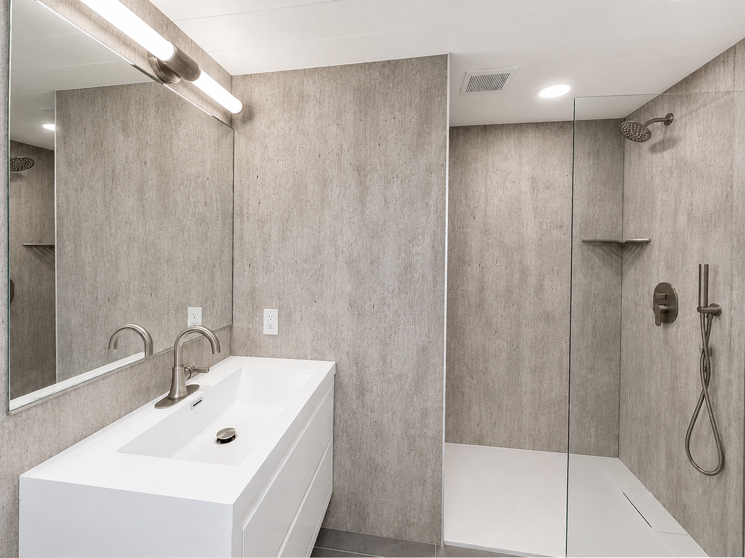 Modern bathroom with floating vanity and glass shower for Vistacraft bathroom design services